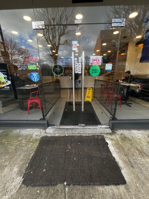 Glass double doors. Pull from middle to open.