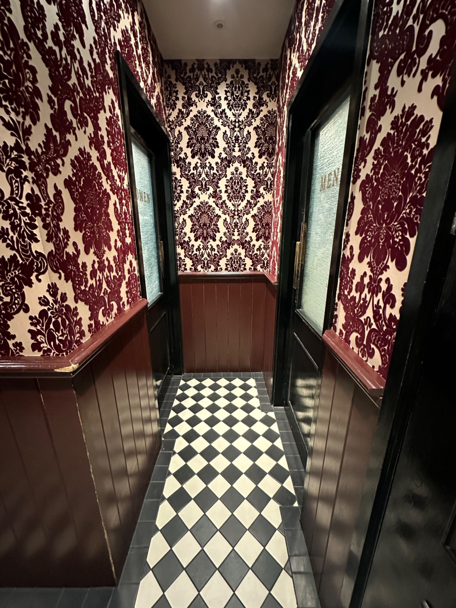 From end of path facing left. Toilet doors on left and right.