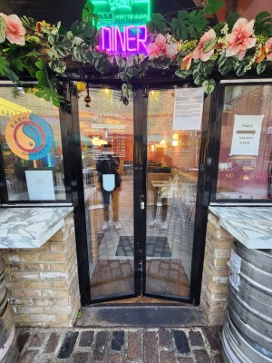 Black bordered doors. Push from center to open.