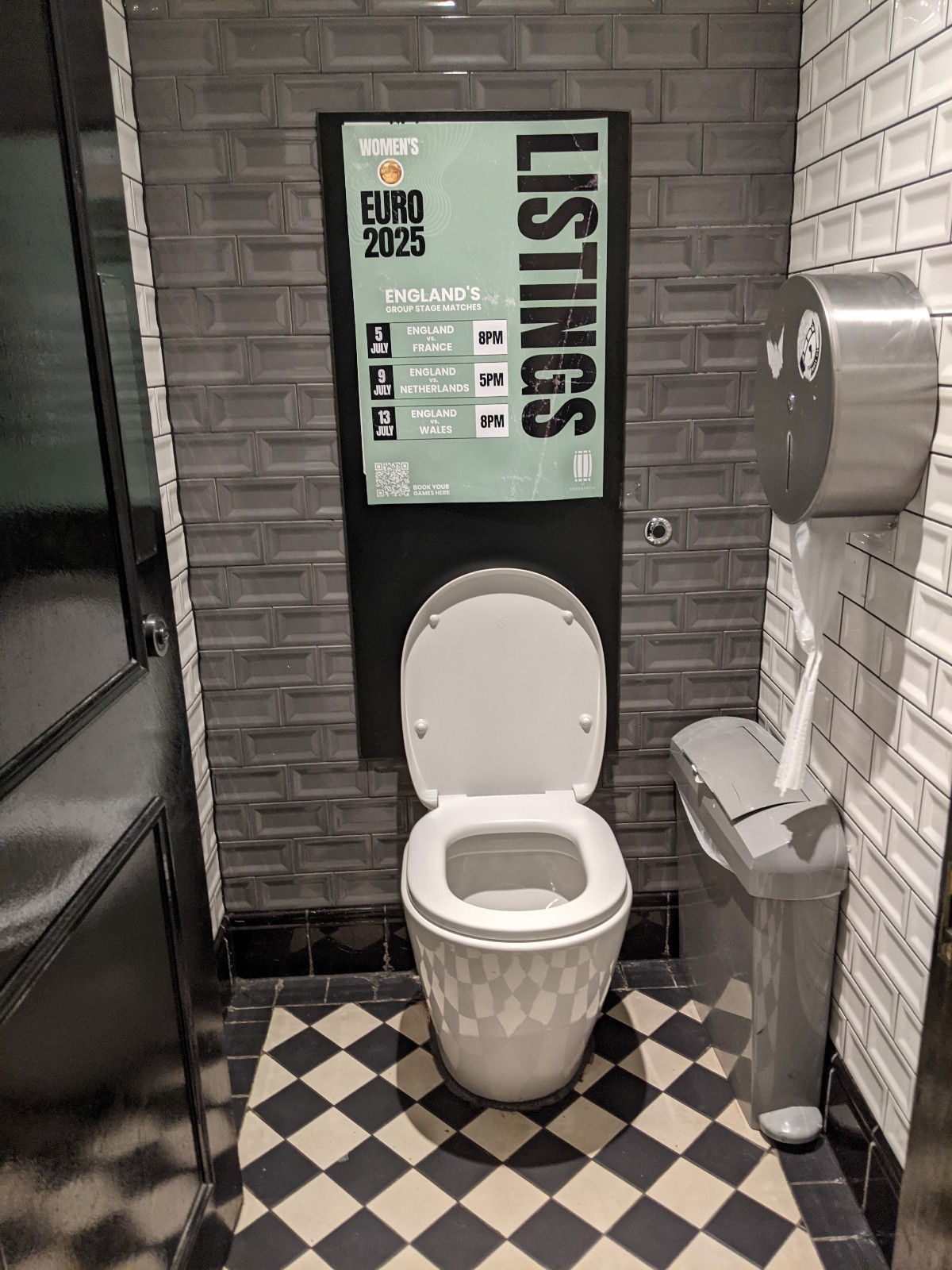 From stall facing straight. Toilet ahead, bin on right.