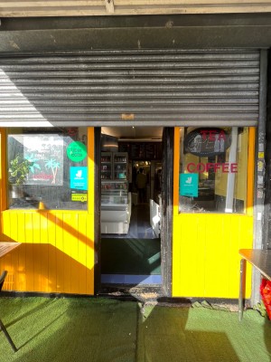 Single black door with glass panelling push from left to open.