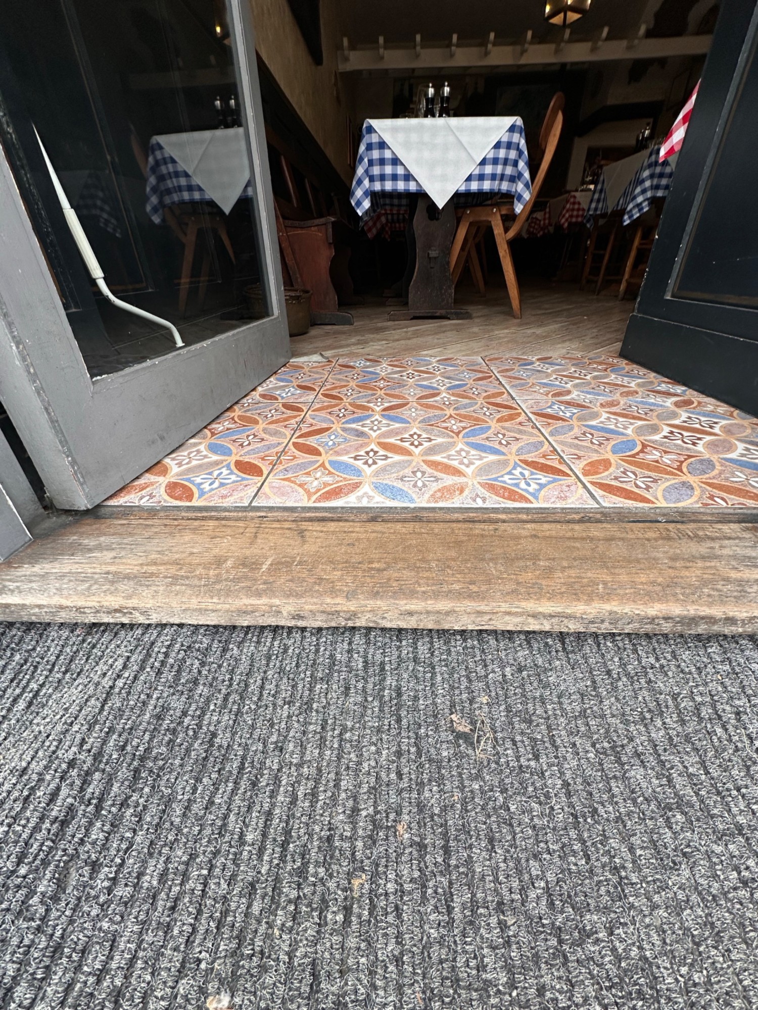 Small step at foot of door.