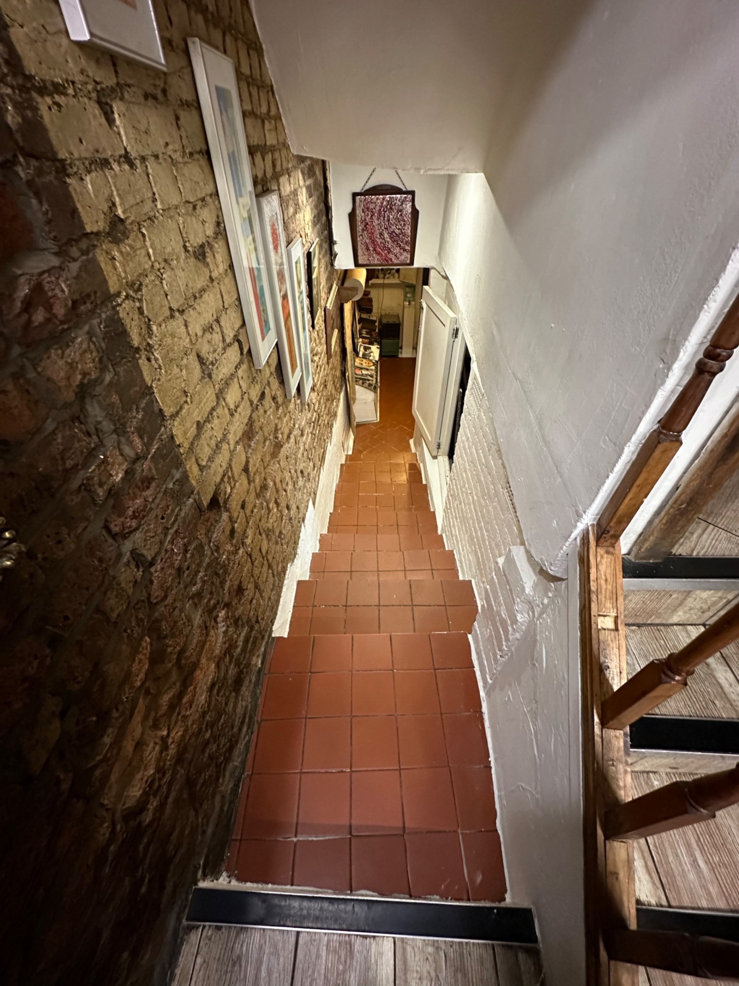 From top of stairs looking straight ahead. No handrail.