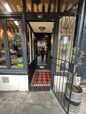 Built in ramp leading to black metal gate. Pull from left.