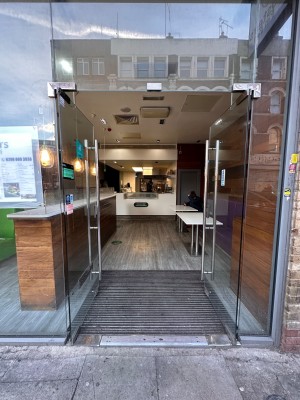 Glass doors ahead. Push to open via metal hand rails in center.