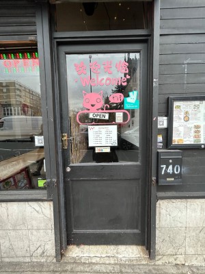 Black and glass panelled door. Push silver handle from left to open.
