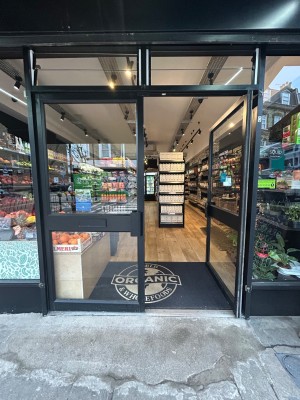 Double glass doors with black border. Push handles from middle to open.