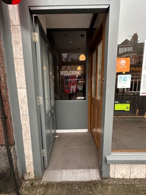 First preceding entrance door. Glass and wood panelled door - push from right. Second entrance door immediately to right.