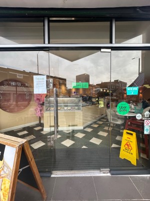 Glass door ahead. Push handle on left to open.