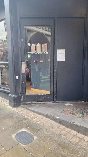 This is the front door which has a diagonal step. There is a bell you can ring for assistance.