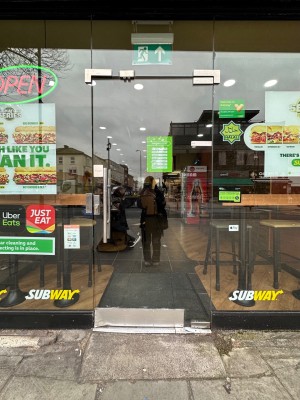 Built in ramp up to glass door. Handle at left. Push to open.