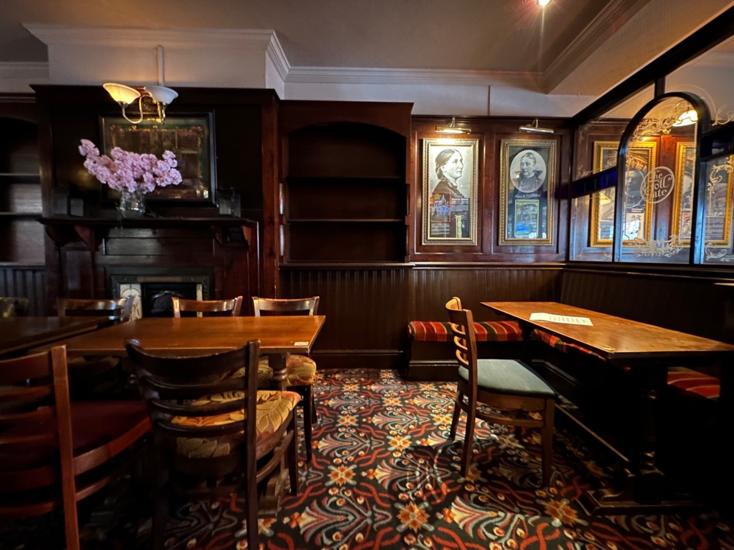 From after column facing right. Half booth on right. Tables and chairs on left.