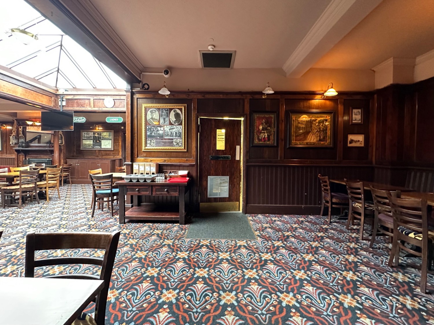 From left of dart stand facing straight. Half booths along right.