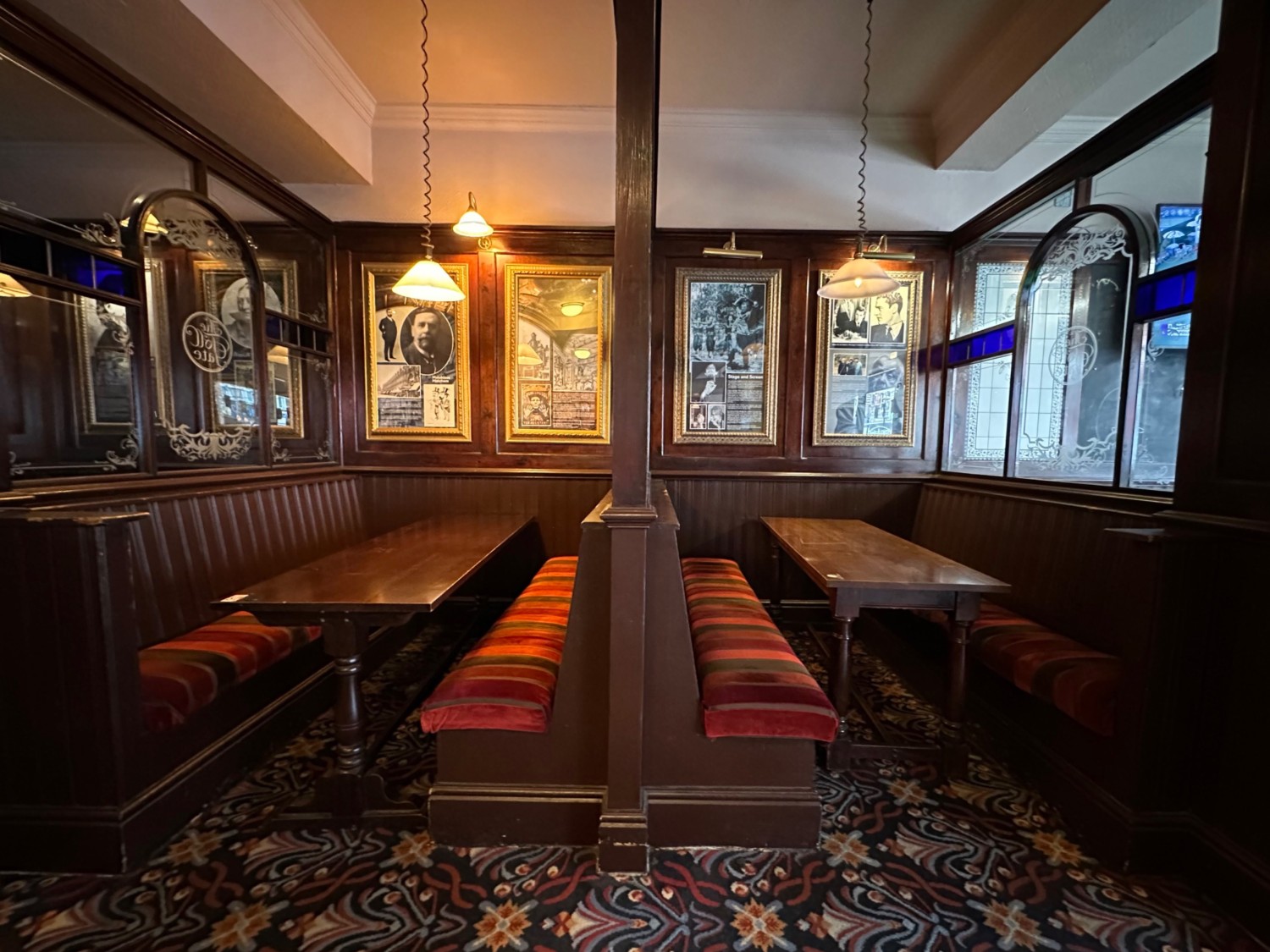 From bar facing right. Booths ahead at back wall.