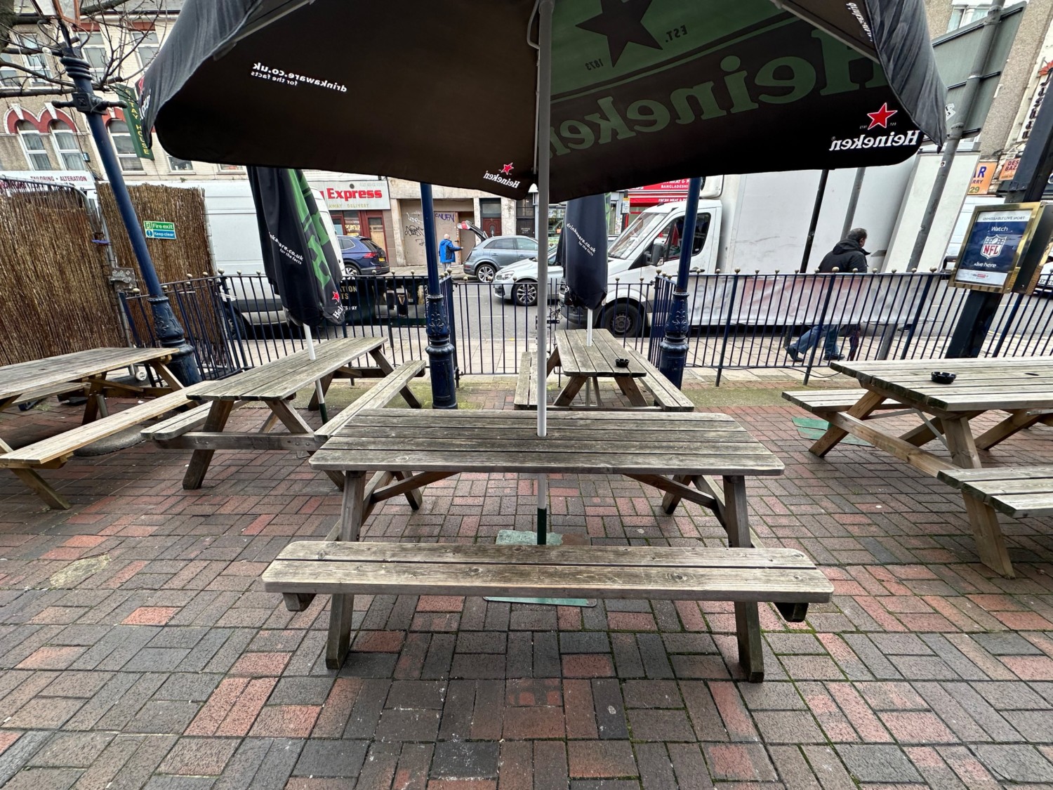 From doors facing straight. Picnic tables scattered ahead.