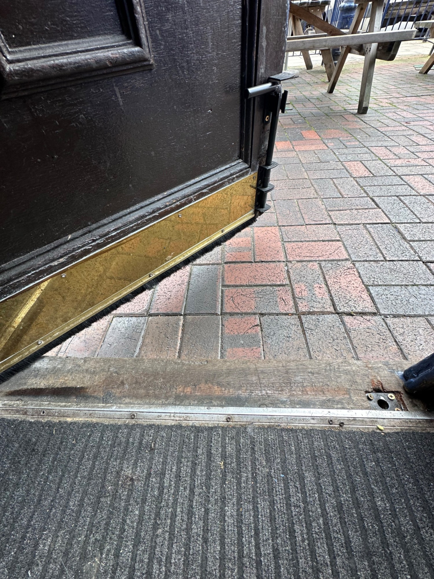 One step down at foot of doors.