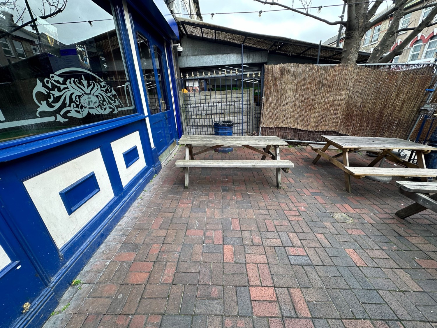 From doors facing left. Picnic benches ahead.