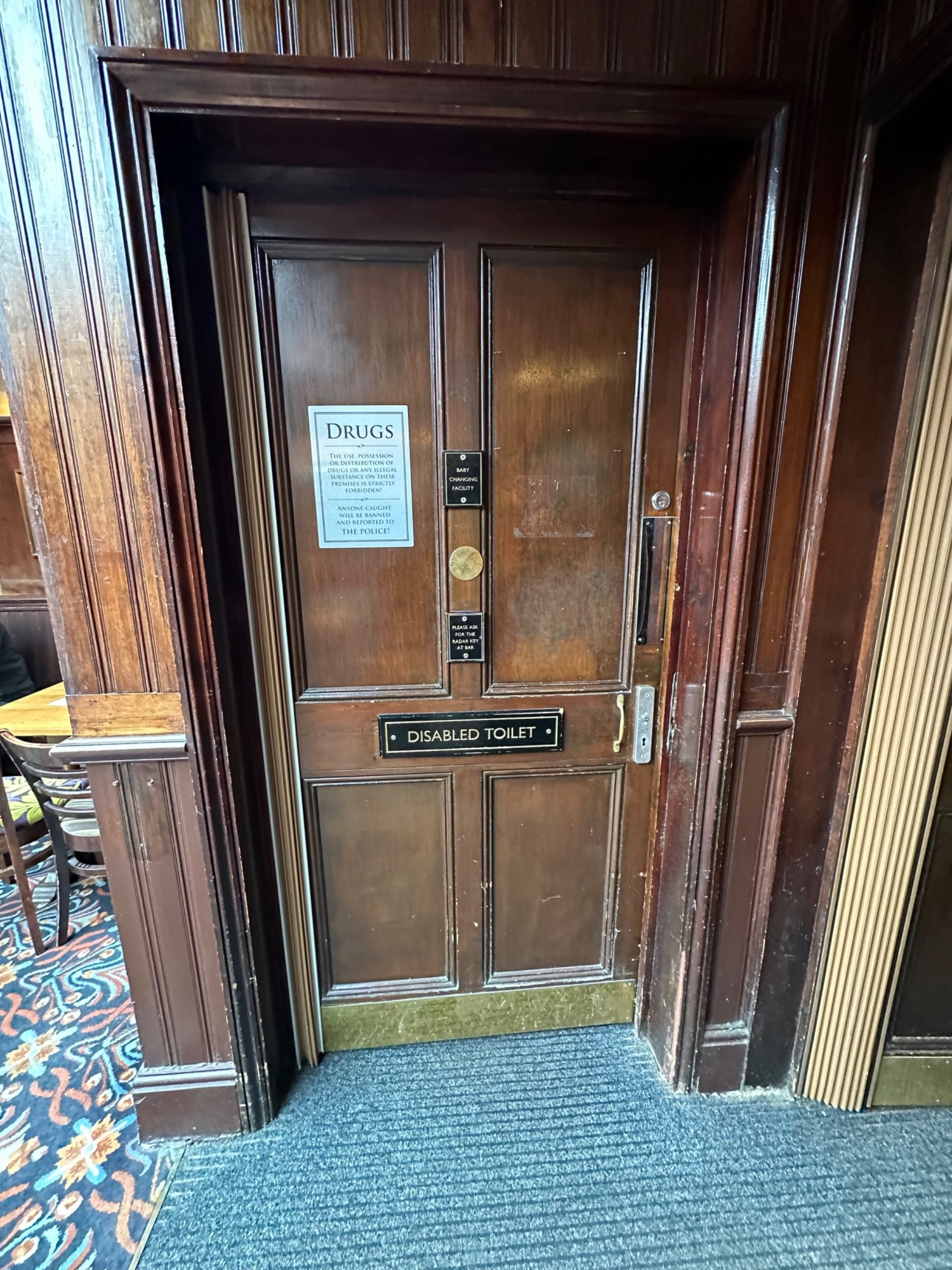 From back left of back area facing left. Wooden preceding door ahead. Push from right to open. Radar keyhole to right.