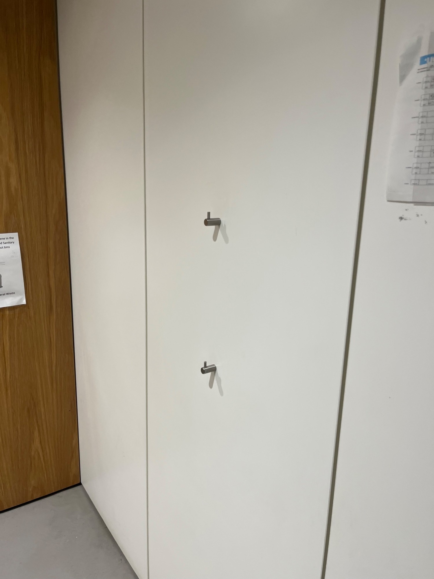 Hooks on wall and provided.
