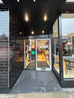 Opening ahead leads to main entrance door at back.