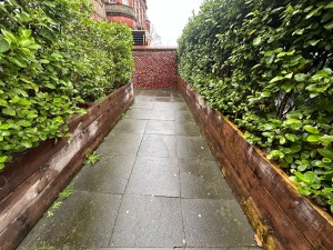 From street, facing right towards built-in ramp. Ramp ahead. Landing at the end.