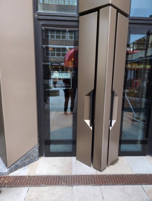 Heavy door,  see-through, need to pull, step-free