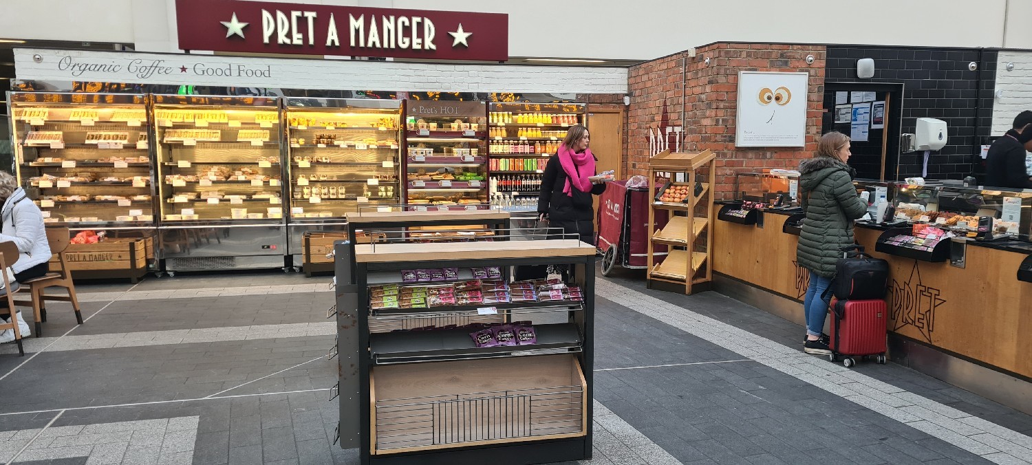 Food selection from open chiller cabinets.  Wide aisles, smooth flooring and turning spaces.