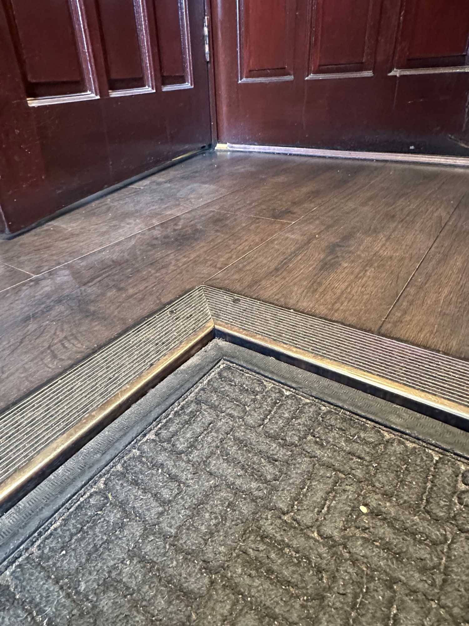 Rug followed by small bump after the first set of doorway.