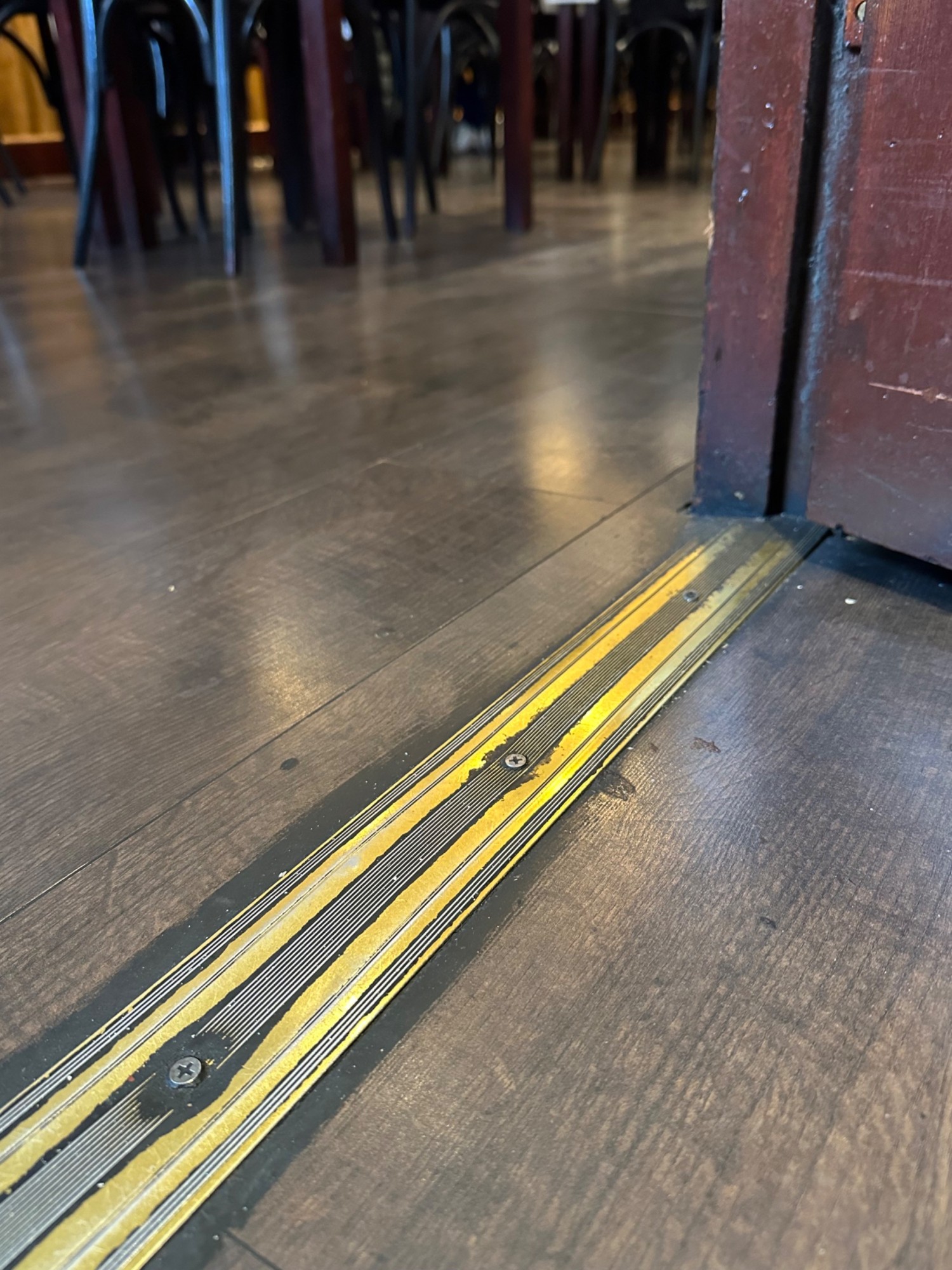 Small bump at foot of the second set of door before entry.