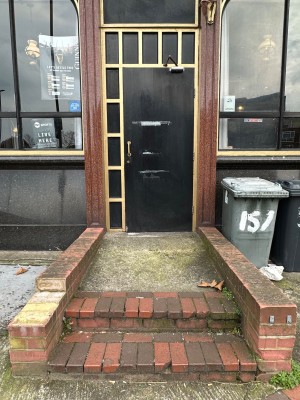 Two steps followed by built in ramp to the entrance.