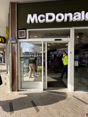 White framed glass door. Door slides to left to open.