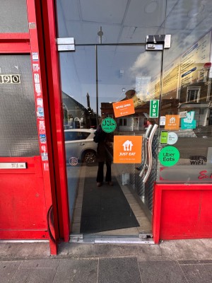 Glass door. Push silver handle from right to open.