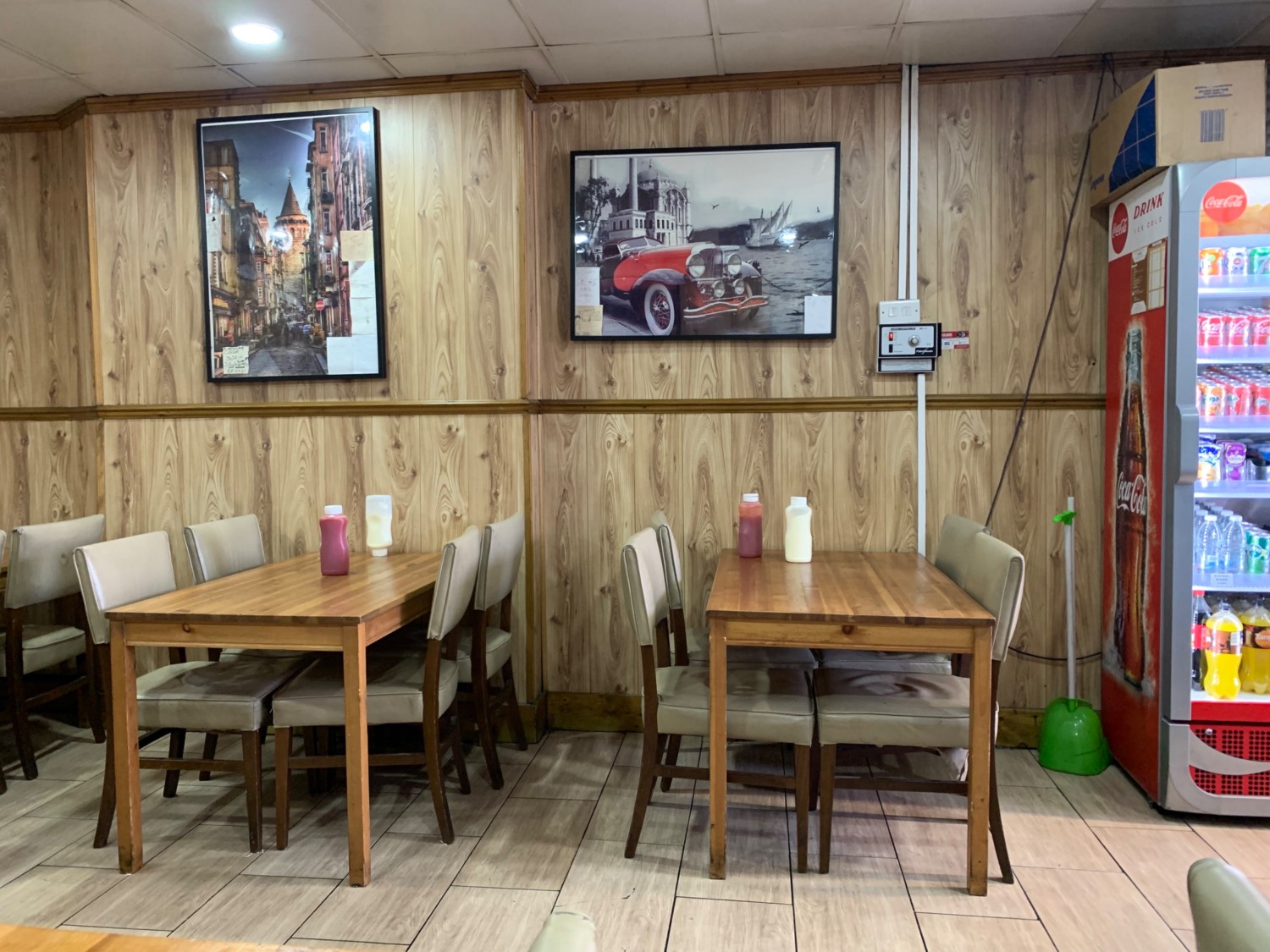 From end of counter facing right. Seating along back wall. Fridge to right side of back wall.
