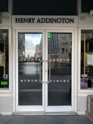 Double glass door with white frame ahead. Pull from centre to open.