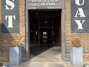 Open archway. Grey, wooden frame.