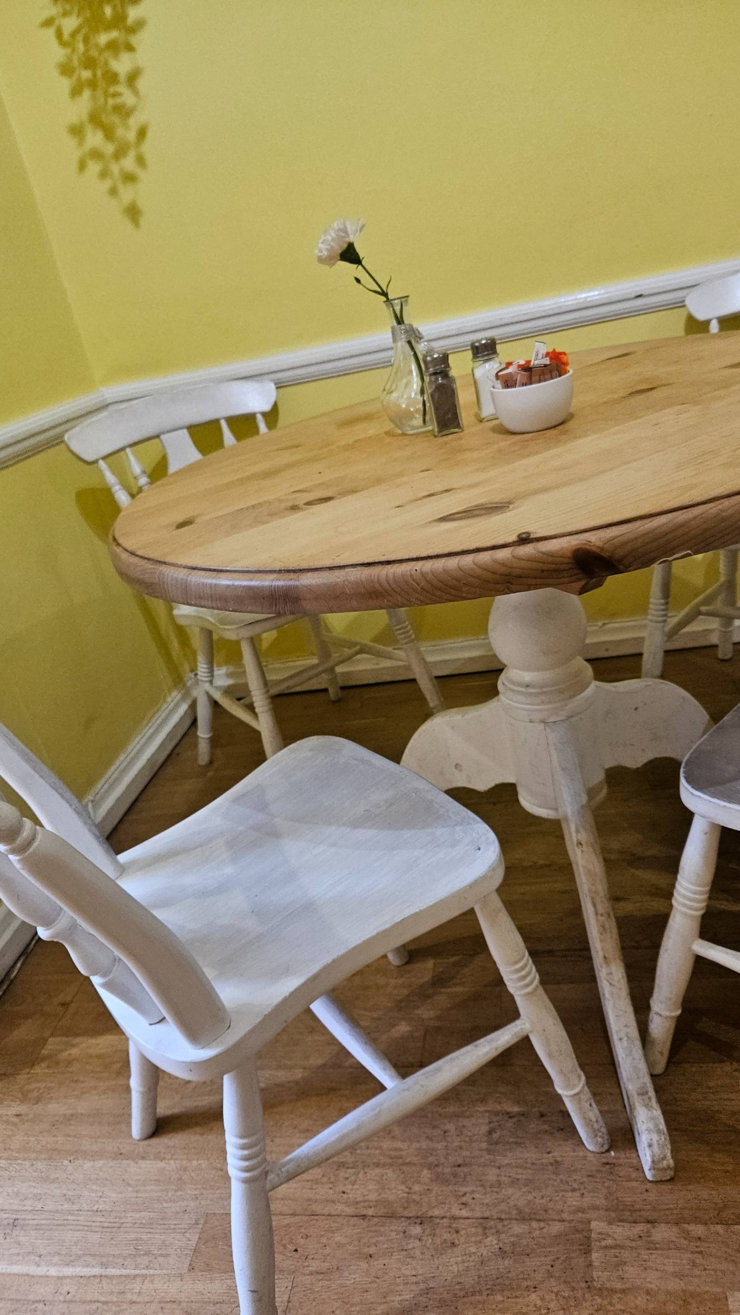 A wooden table in the eating area