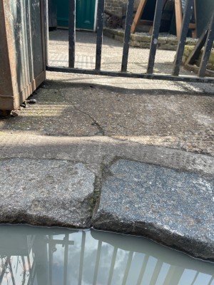 Small step, from the main street to the pavement. Entrance door straight ahead.