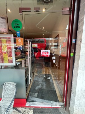 Glass door ahead. Push handle on left to open.