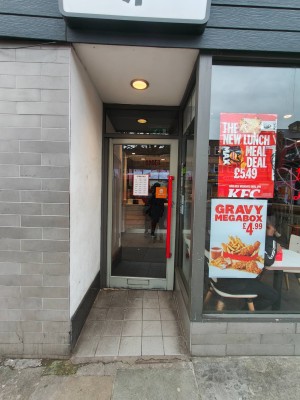 Facing archway leading to entrance. Entry door ahead.
