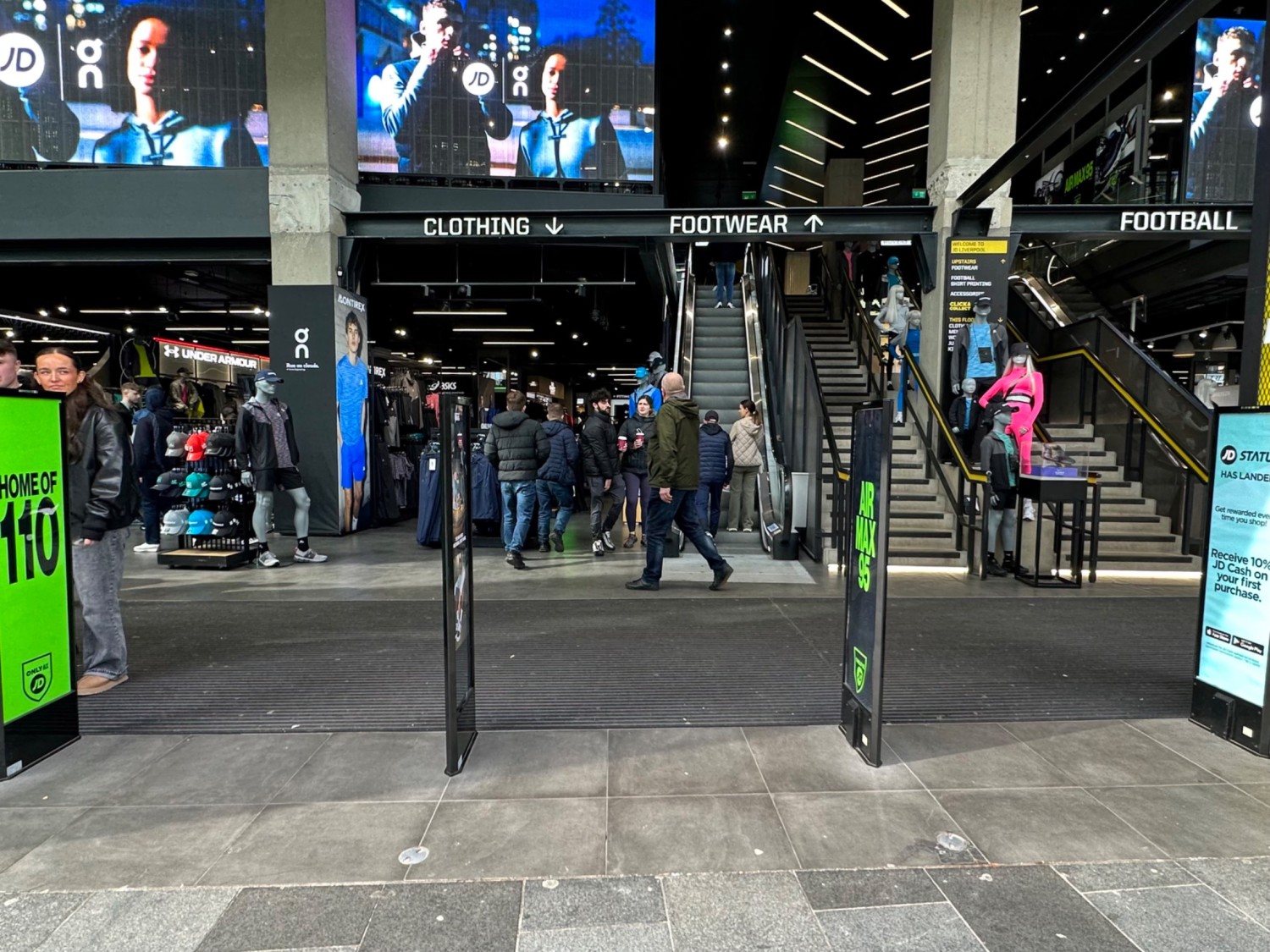 From left archway facing straight, security barriers spread evenly across entrance.