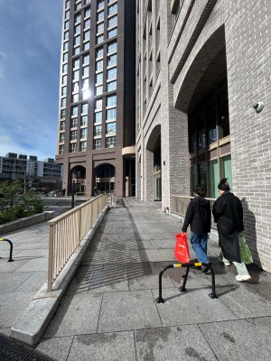 From street, facing right of venue. Built in ramp ahead leads to venue on back left.