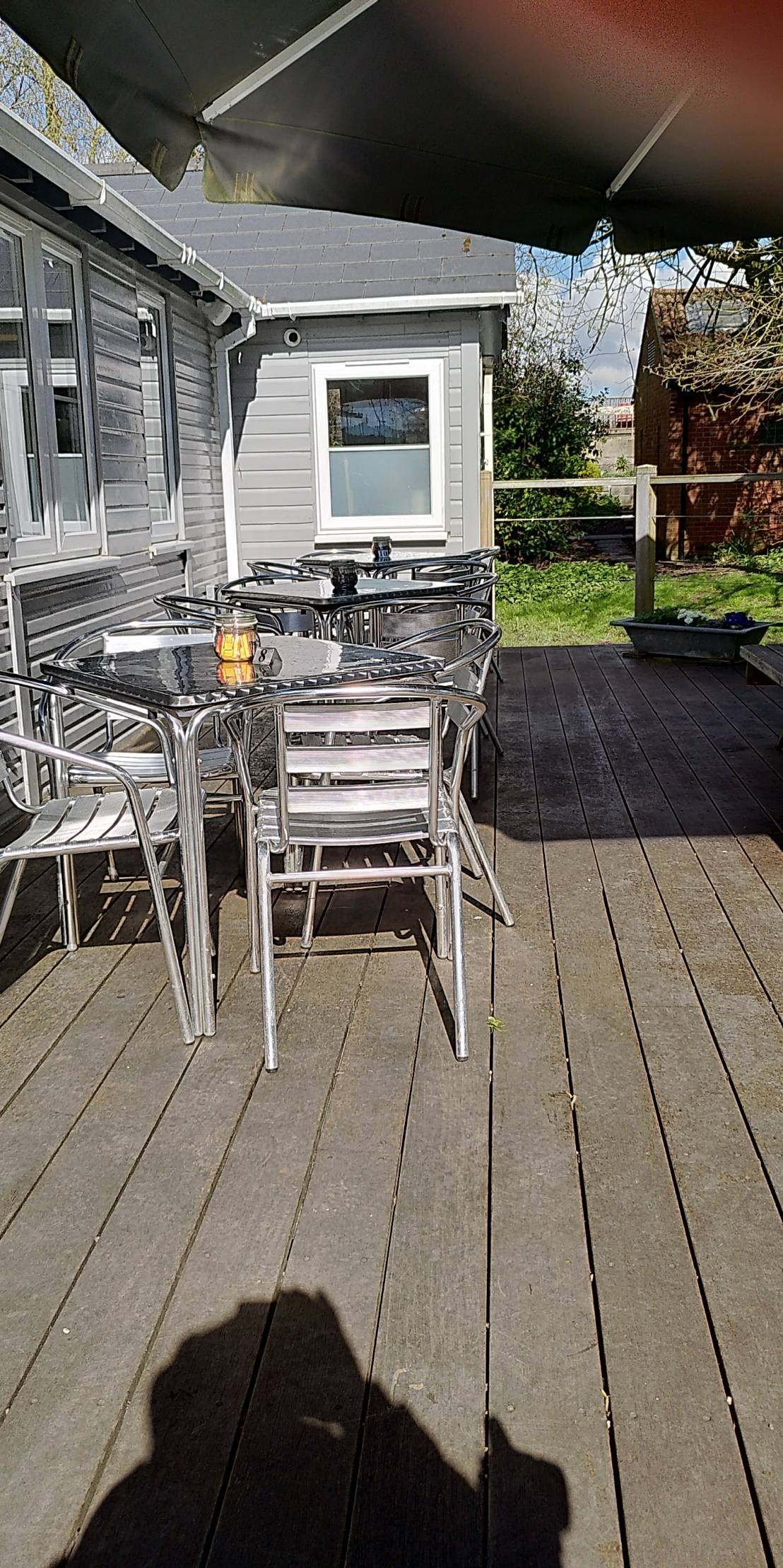 Café tables and chairs on decking