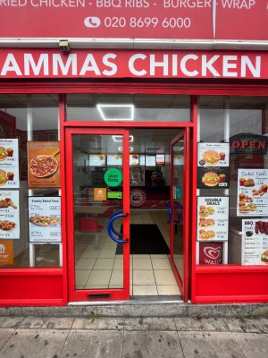 Red framed glass doors. Push open via blue handle in centre.