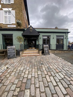 From street, looking at venue. Path ahead to stairs and entrance door.