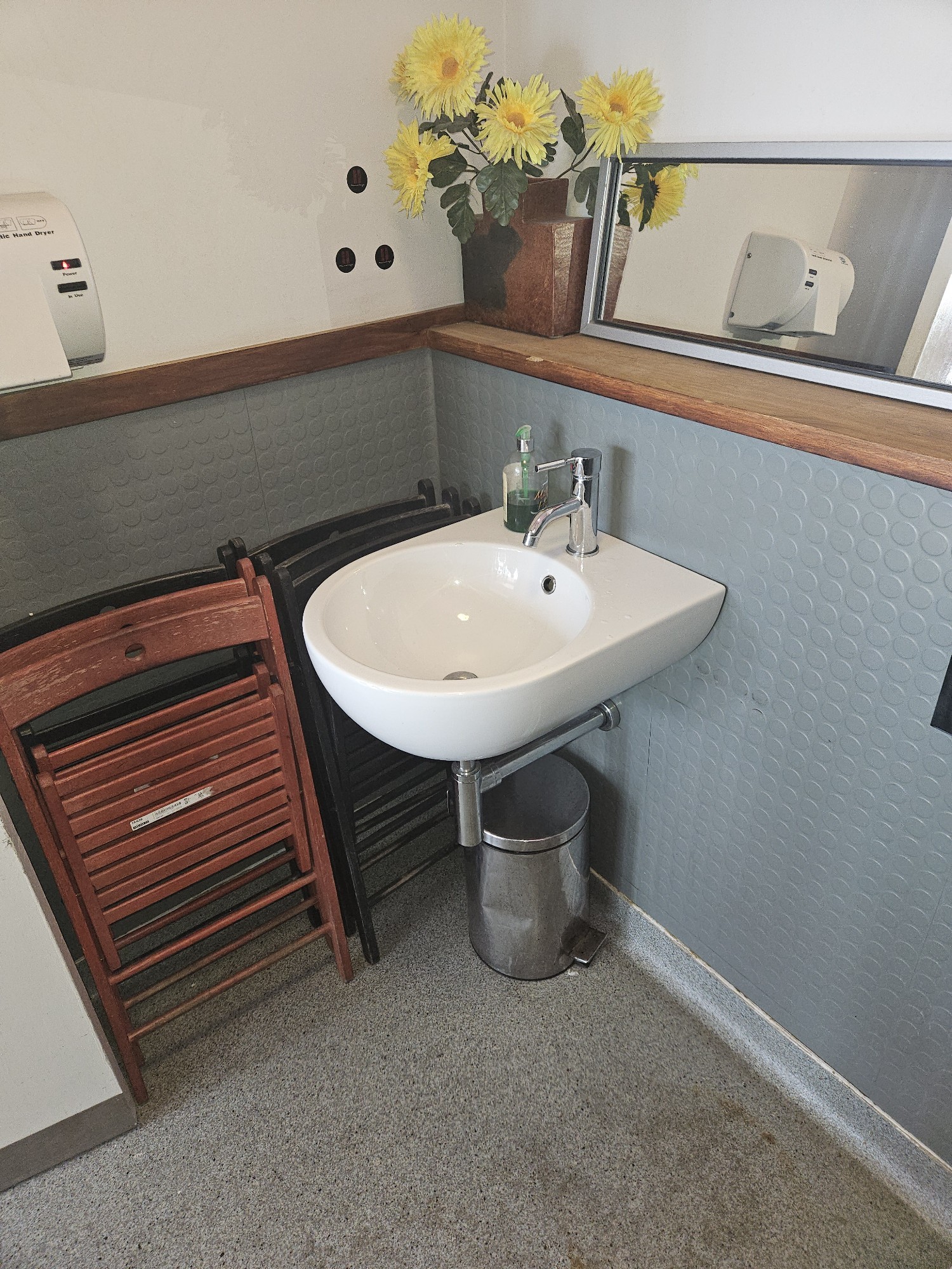The sink and dryer of the bathroom