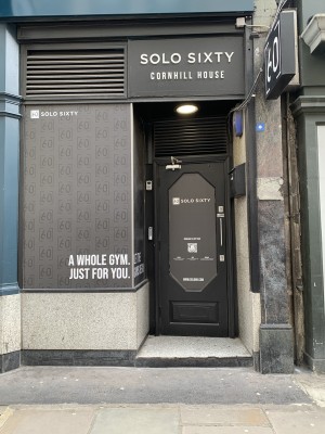 manual pull door opens to the left with a step from the pavement