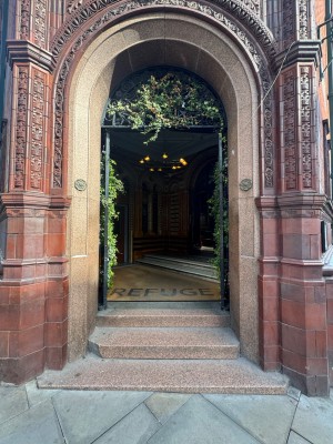 The main entrance has a couple of steps.