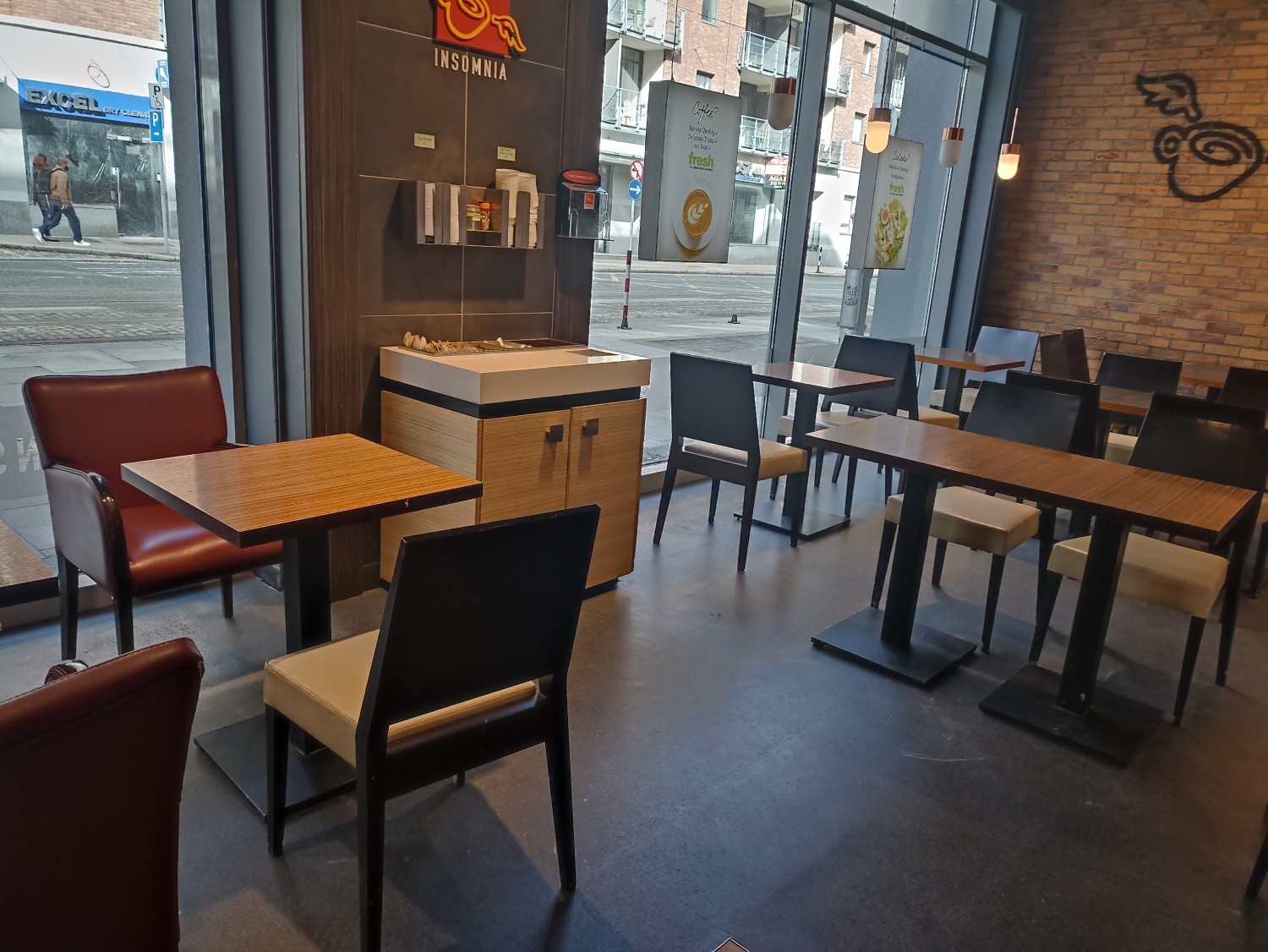 Cafe area at the window, front left corner of the shop. No obstacles.