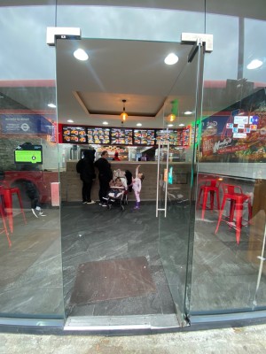 Glass door ahead. Pull handle on left to open.