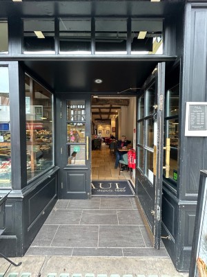 Black open archway in front. Main door at back.